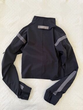 Gymshark Black Jacket with Reflective Gray Stripes